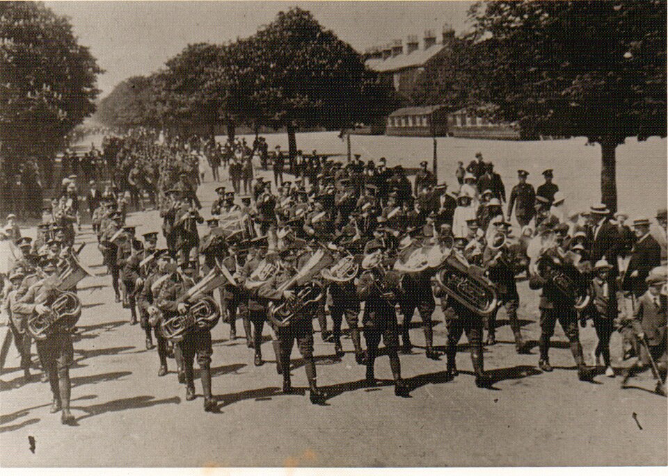 Mounted military band and returning troops in Aldershot, Hampshire, on 26 July 1945